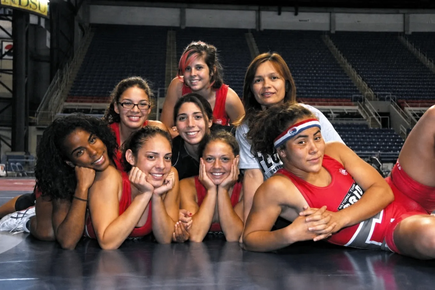 Coach Lil coaching Florida State's women's wrestling team at national championships